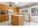 Bright kitchen boasts ample cabinet space, a center island, and modern appliances at 1789 Castro Hill Ave, Henderson, NV 89012