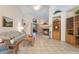 Spacious living room with tile flooring, a cozy fireplace, and abundant natural light at 1789 Castro Hill Ave, Henderson, NV 89012