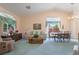 Inviting living room with vaulted ceilings, large windows and dining area at 1789 Castro Hill Ave, Henderson, NV 89012