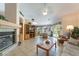 Cozy living room with fireplace, built-in shelving, and seamless access to the backyard at 1789 Castro Hill Ave, Henderson, NV 89012