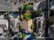 Stunning aerial view of a luxury home featuring a tile roof, swimming pool, and mature landscaping at 1795 Nuevo Rd, Henderson, NV 89014