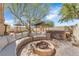 Lovely backyard featuring comfortable seating, a fire pit, hot tub, and covered pergola at 1795 Nuevo Rd, Henderson, NV 89014