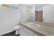 This bathroom features a modern sink, faucet, and a shower with a glass door, creating a sleek design at 1795 Nuevo Rd, Henderson, NV 89014