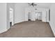 A light-filled bedroom featuring carpeted floors and access to an ensuite bathroom at 1795 Nuevo Rd, Henderson, NV 89014