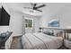 This staged bedroom boasts soft carpet, ample lighting, and a soothing color scheme with stylish decorations at 1795 Nuevo Rd, Henderson, NV 89014