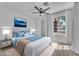 This staged bedroom boasts a well-lit space with large windows and offers a relaxing retreat at 1795 Nuevo Rd, Henderson, NV 89014