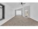 A light-filled bedroom featuring carpeted floors, a ceiling fan, an adjacent bathroom, and recessed lighting at 1795 Nuevo Rd, Henderson, NV 89014