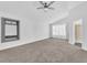 A light-filled bedroom featuring carpeted floors, a ceiling fan, an adjacent bathroom, and recessed lighting at 1795 Nuevo Rd, Henderson, NV 89014
