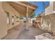 Outdoor covered patio area complete with grill, seating, and brick flooring at 1795 Nuevo Rd, Henderson, NV 89014