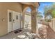 Inviting front door featuring sidelights, classic hardware, and a covered entryway for added curb appeal at 1795 Nuevo Rd, Henderson, NV 89014