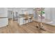 Modern kitchen includes an island, hardwood floors and stainless steel appliances at 1795 Nuevo Rd, Henderson, NV 89014
