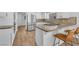Modern kitchen island boasts hardwood floors and stainless steel appliances at 1795 Nuevo Rd, Henderson, NV 89014