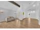 Bright, neutral sitting room boasting a vaulted ceiling, wood floors, with natural light from the backyard at 1795 Nuevo Rd, Henderson, NV 89014