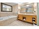 Elegant bathroom featuring a large soaking tub and double sinks, perfect for relaxation and convenience at 2000 N Fashion Show Dr # 4318, Las Vegas, NV 89109