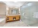 Luxurious bathroom featuring a soaking tub, a spacious glass shower, and double sinks with ample counter space at 2000 N Fashion Show Dr # 4318, Las Vegas, NV 89109