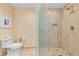Beautifully tiled bathroom featuring a glass enclosed shower, toilet, and modern fixtures at 2000 N Fashion Show Dr # 4318, Las Vegas, NV 89109