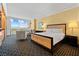 Comfortable bedroom with a king bed, sitting area, and expansive windows offering stunning city views at 2000 N Fashion Show Dr # 4318, Las Vegas, NV 89109