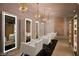 Contemporary salon with mirrors, chairs, and diamond-shaped chandeliers, offering a luxurious experience at 2000 N Fashion Show Dr # 4318, Las Vegas, NV 89109