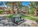 Inviting common area featuring picnic tables, a gazebo, and lush landscaping for outdoor relaxation and enjoyment at 2200 S Fort Apache Rd # 2041, Las Vegas, NV 89117