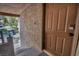 Exterior entrance showcasing a brown door with keypad and stone and stucco wall at 2200 S Fort Apache Rd # 2041, Las Vegas, NV 89117