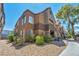 Building exterior featuring terracotta roofing and desert landscaping on a clear, sunny day at 2200 S Fort Apache Rd # 2041, Las Vegas, NV 89117