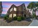 Building exterior shot at dusk with terracotta roofing and desert landscaping at 2200 S Fort Apache Rd # 2041, Las Vegas, NV 89117