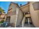 Exterior angle features stairs leading to units with terracotta-colored roofs at 2200 S Fort Apache Rd # 2041, Las Vegas, NV 89117