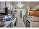 Galley kitchen with granite counters, white appliances, and ample cabinet space at 2200 S Fort Apache Rd # 2041, Las Vegas, NV 89117