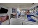 Open-concept living room with a large flat screen tv, sofa, gas fireplace, and a sliding glass door at 2200 S Fort Apache Rd # 2041, Las Vegas, NV 89117