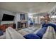 Living room featuring a large sectional sofa, flat screen tv, gas fireplace, and a sliding glass door at 2200 S Fort Apache Rd # 2041, Las Vegas, NV 89117