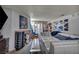 Spacious living room showcasing a sleek white sectional sofa, gas fireplace, and large art pieces at 2200 S Fort Apache Rd # 2041, Las Vegas, NV 89117
