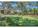 Manicured putting green in a lush community setting, complete with mature trees and greenery at 2200 S Fort Apache Rd # 2041, Las Vegas, NV 89117