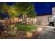 Beautiful backyard with manicured lawn, mature trees, and private outdoor space at 2333 Indigo Island St, Henderson, NV 89044