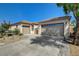 Charming single-story home with desert landscaping, circular driveway and three-car garage at 2333 Indigo Island St, Henderson, NV 89044