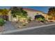 Charming single-story home featuring well-maintained landscaping and rock lawn at 2333 Indigo Island St, Henderson, NV 89044