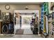 View of a well-organized garage leading to the backyard, with ample storage and work space at 2333 Indigo Island St, Henderson, NV 89044