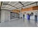 View of a spacious garage featuring storage cabinets, epoxy flooring, and ample workspace at 2333 Indigo Island St, Henderson, NV 89044