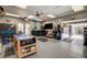 Spacious garage featuring epoxy floors, custom cabinets, a TV, and ample storage for tools and equipment at 2333 Indigo Island St, Henderson, NV 89044