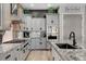 Modern kitchen with stainless steel appliances, granite countertops, and ample cabinet space at 2333 Indigo Island St, Henderson, NV 89044