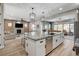 Bright, open layout connects the modern kitchen island to the living room at 2333 Indigo Island St, Henderson, NV 89044