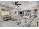 Open-concept living area showcasing seamless flow between the living room, dining area, and modern kitchen at 2333 Indigo Island St, Henderson, NV 89044
