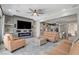 Inviting living room with stylish furniture, entertainment center, and open view to the kitchen at 2333 Indigo Island St, Henderson, NV 89044