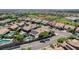Aerial view of neighborhood with community park, lush landscaping, and manicured lawns at 2333 Indigo Island St, Henderson, NV 89044