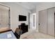 Functional office space with neutral tones, closet, bathroom, and well-lit desk at 2333 Indigo Island St, Henderson, NV 89044