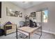 Bright office with large window, sleek desk, storage cabinets, and aviation-themed decor at 2333 Indigo Island St, Henderson, NV 89044