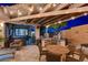 Covered patio featuring a built-in BBQ, seating, and charming outdoor dining area at 2333 Indigo Island St, Henderson, NV 89044