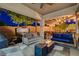 Covered patio boasts comfortable seating, a fire pit, and access to an outdoor spa at 2333 Indigo Island St, Henderson, NV 89044