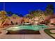 Beautiful pool and spa with meticulous landscaping, lighting, and surrounding patio space at 2333 Indigo Island St, Henderson, NV 89044