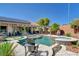 Stunning backyard oasis featuring a sparkling pool, spa, and meticulously designed landscaping at 2333 Indigo Island St, Henderson, NV 89044