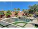 Resort-style pool and spa surrounded by lush landscaping and a waterfall feature at 2333 Indigo Island St, Henderson, NV 89044